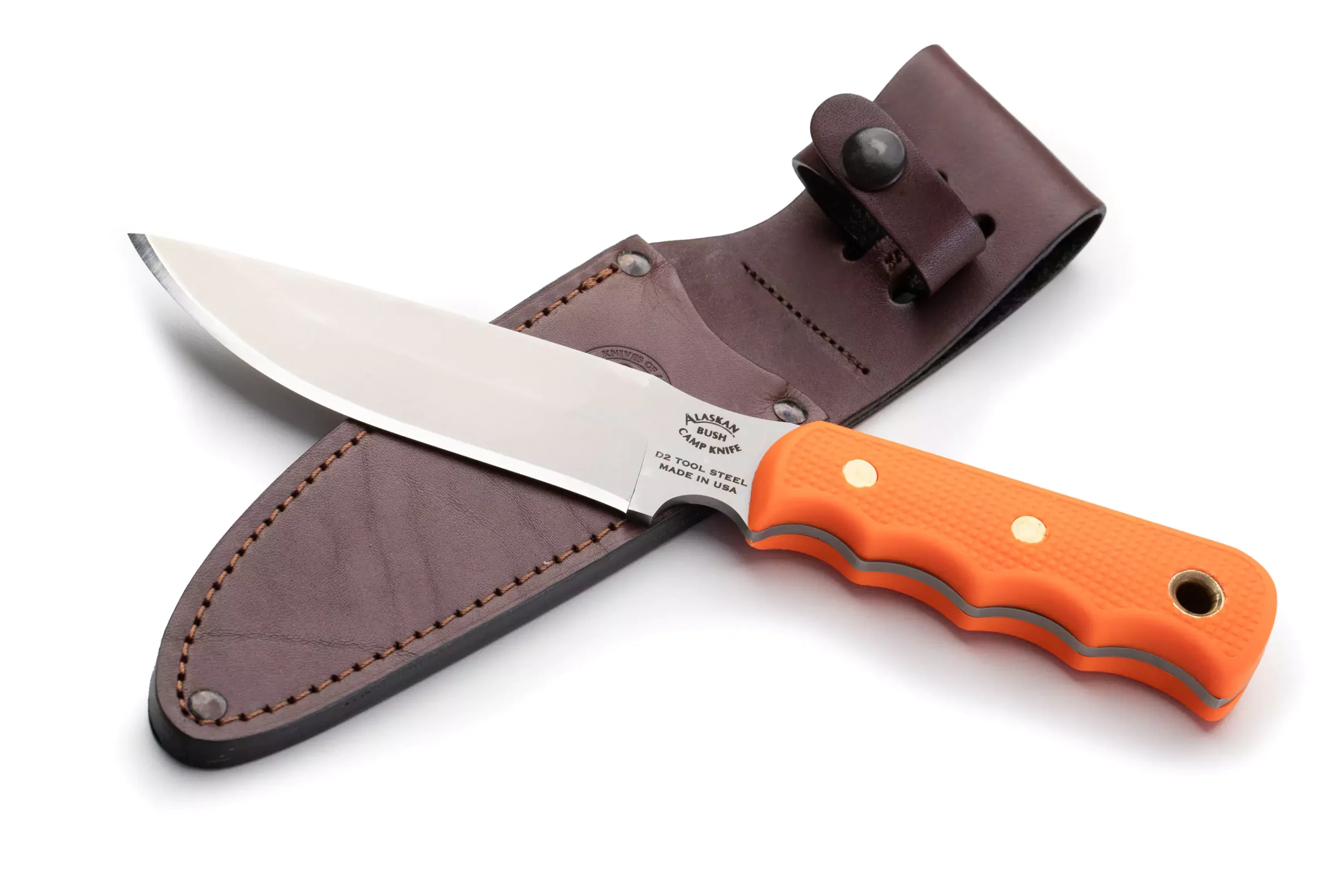 Bush Camp knife with orange Suregrip handle and full-tang D2 steel blade resting on a brown leather sheath