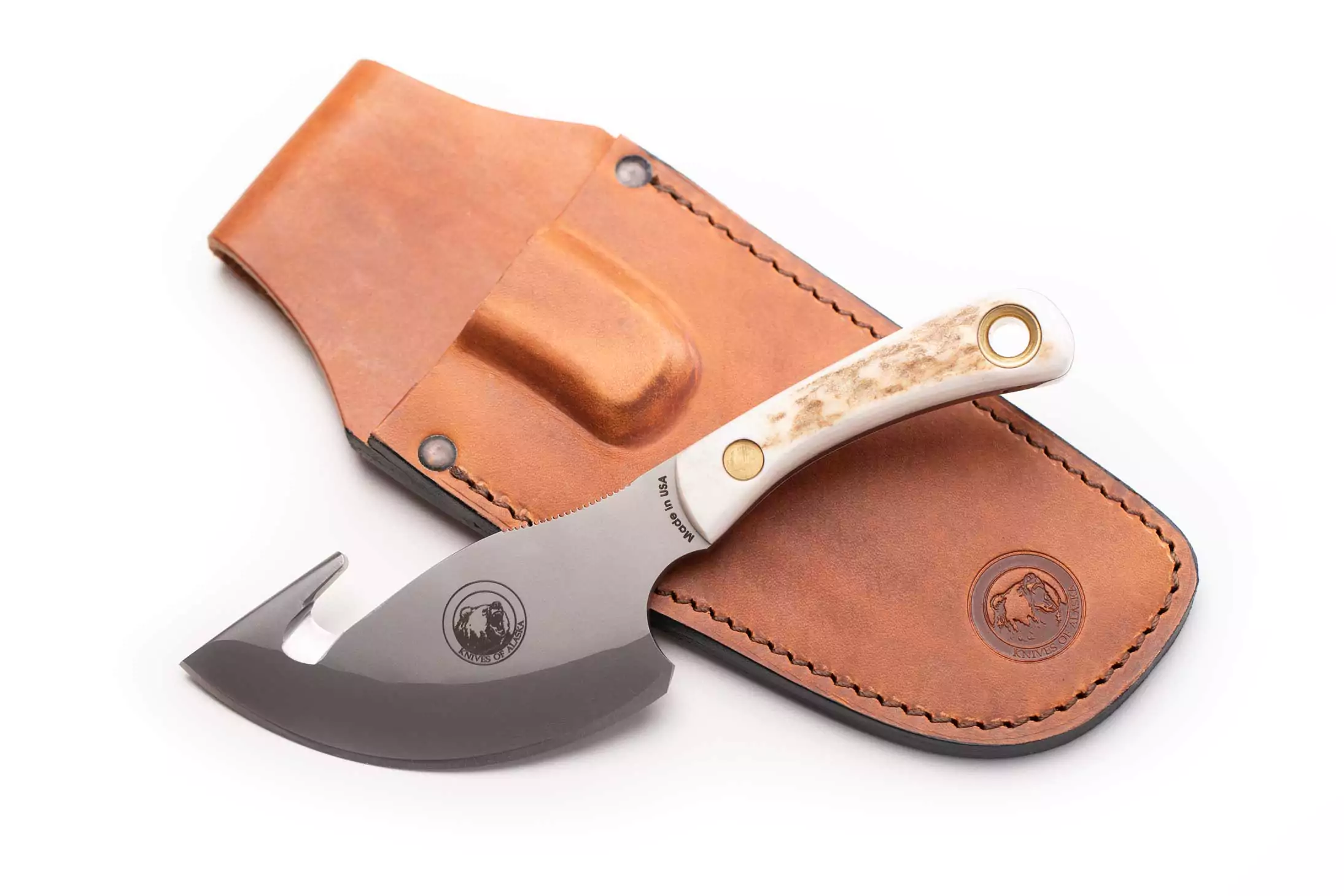 Light Hunter knife with stag handle and gut hook beside leather sheath