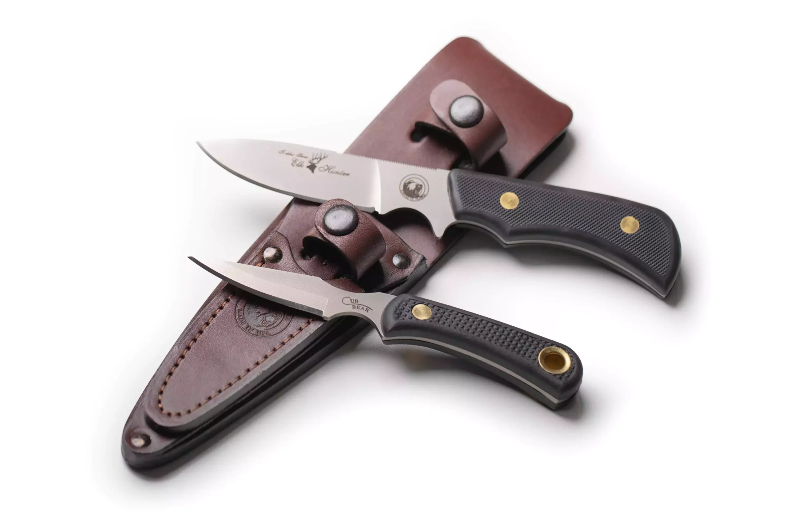 Trekker Elk Hunter and Cub Bear Combo knives with SureGrip handles and D2 tool steel blades displayed with leather sheath.