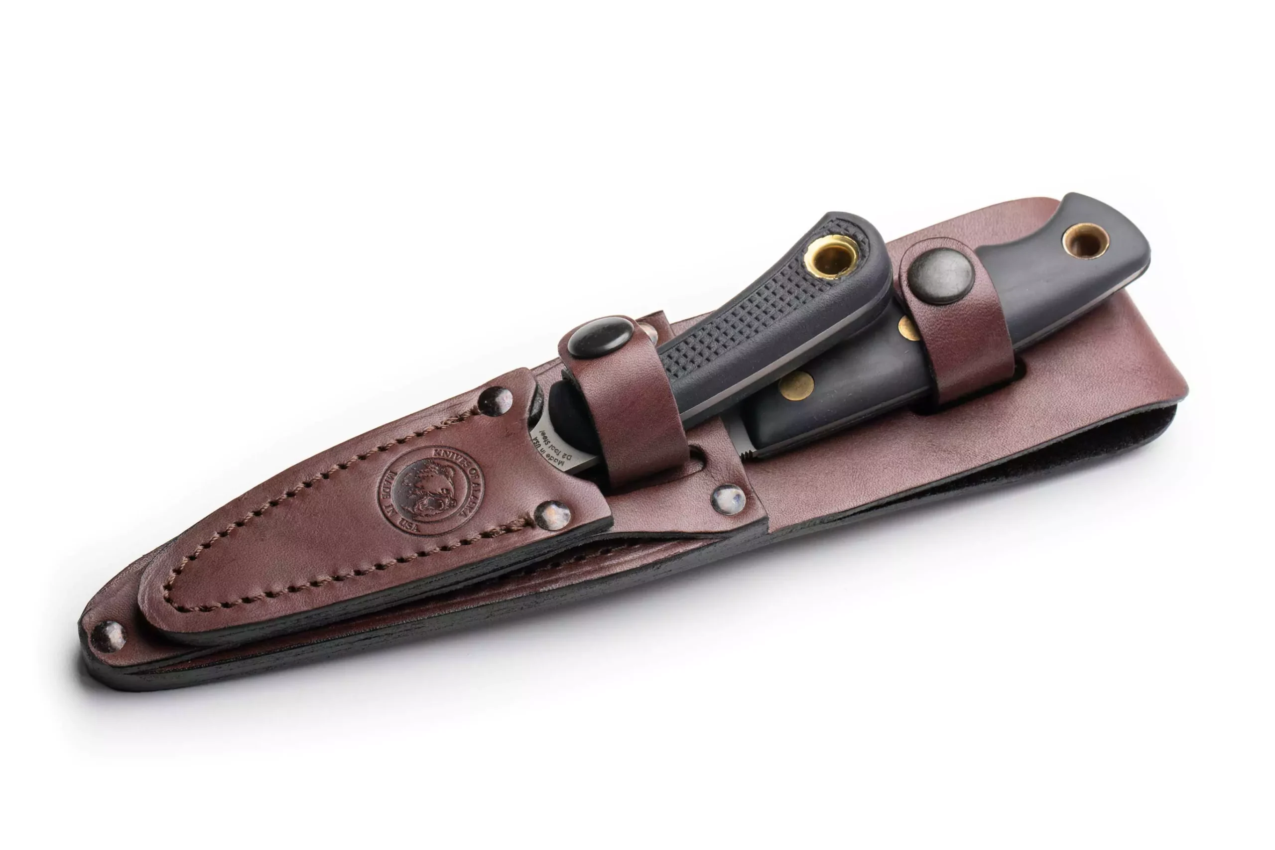 Knives of Alaska Jaeger and Cub Bear knife combo with black Suregrip handles secured in a dark brown leather sheath.