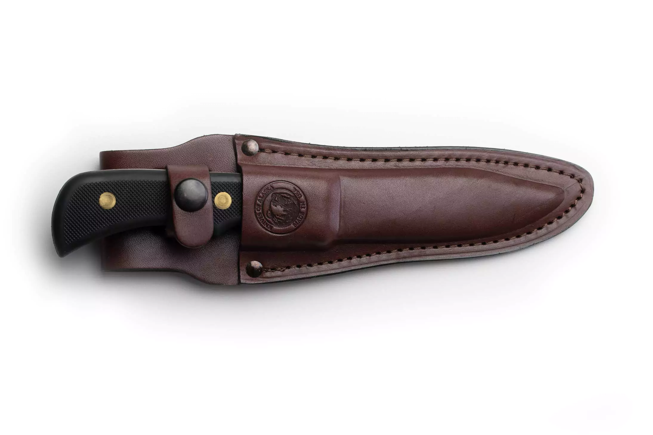 Trekker Whitetail knife with Suregrip black handle secured in brown leather sheath.