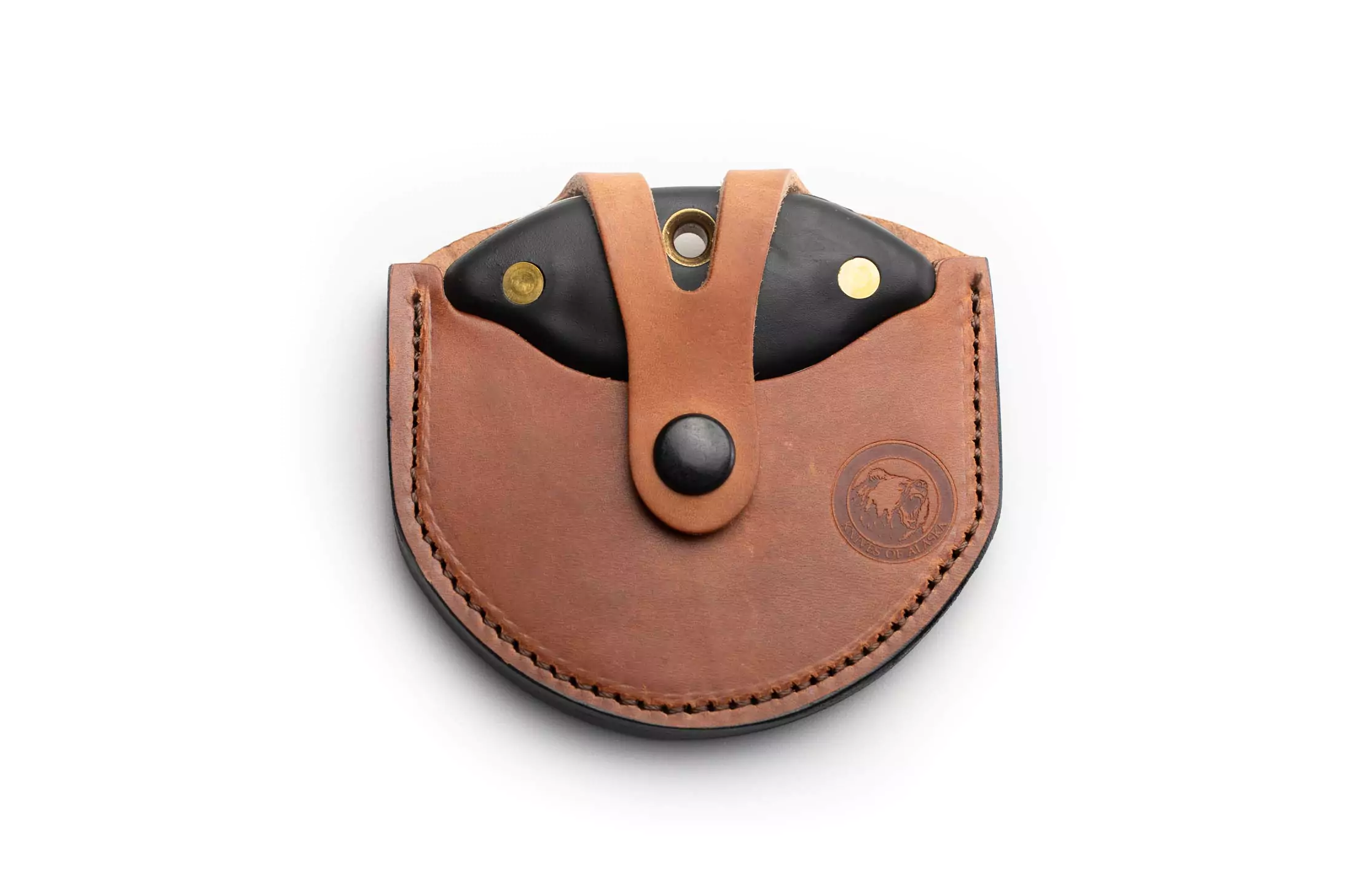 Magnum Ulu knife with black Suregrip handles secured in leather sheath