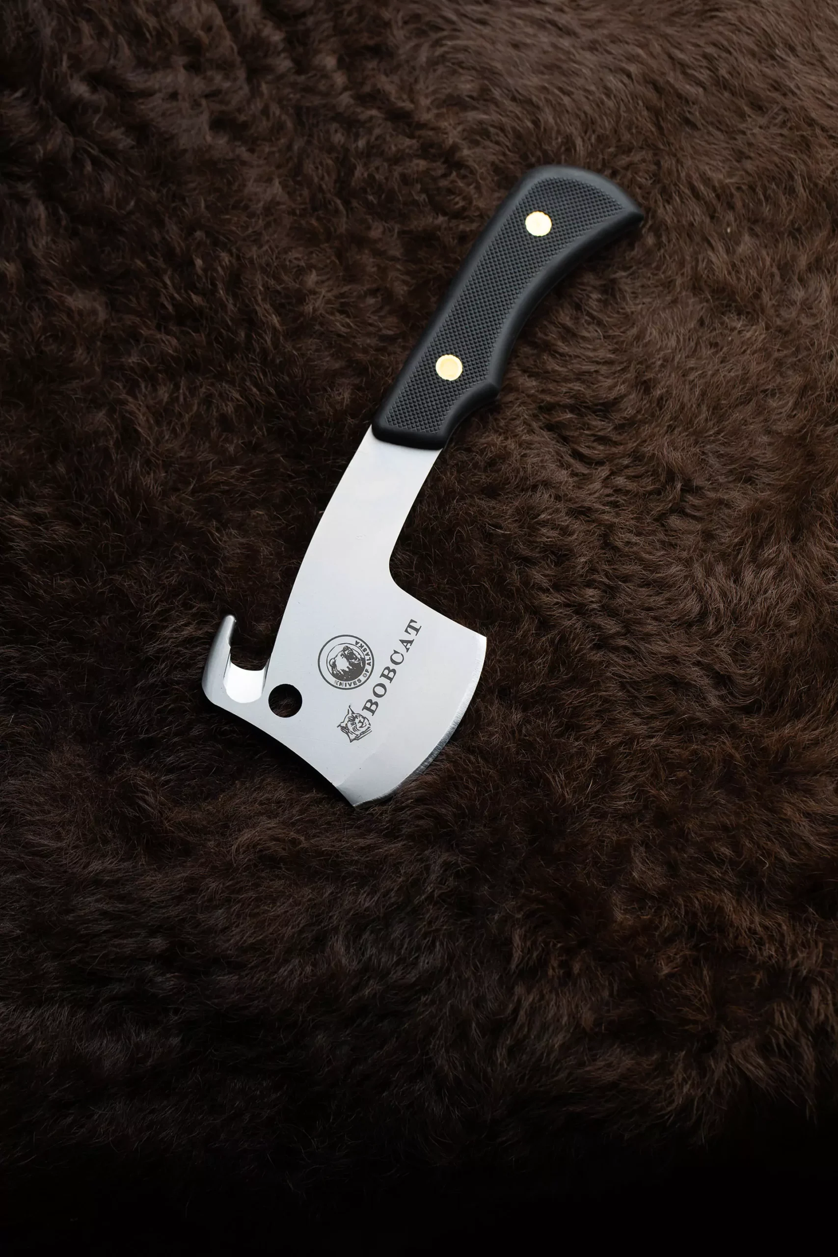Bobcat knife with D2 steel and extra-large gut hook on orange suede