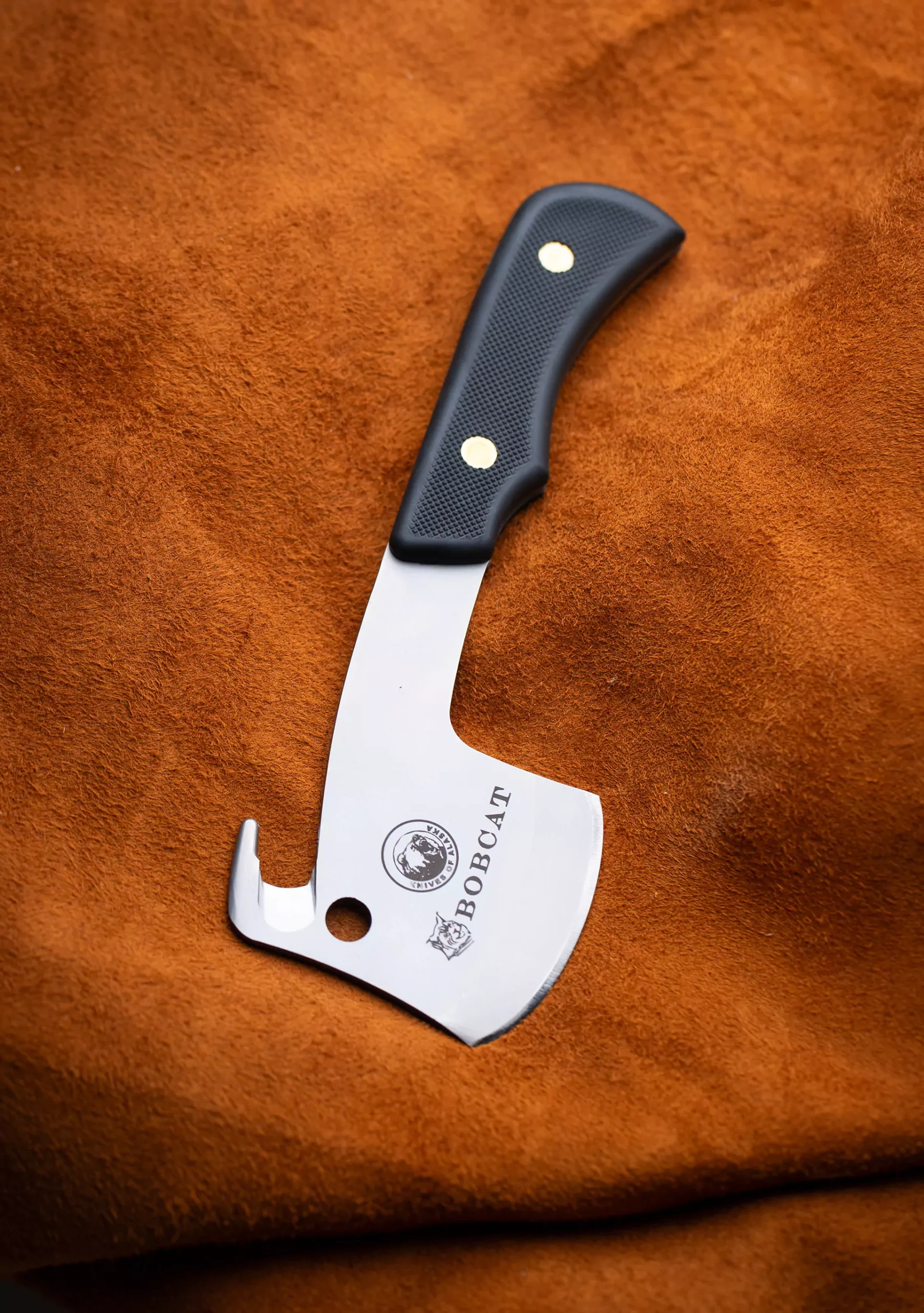 Bobcat knife with D2 steel and extra-large gut hook on orange suede