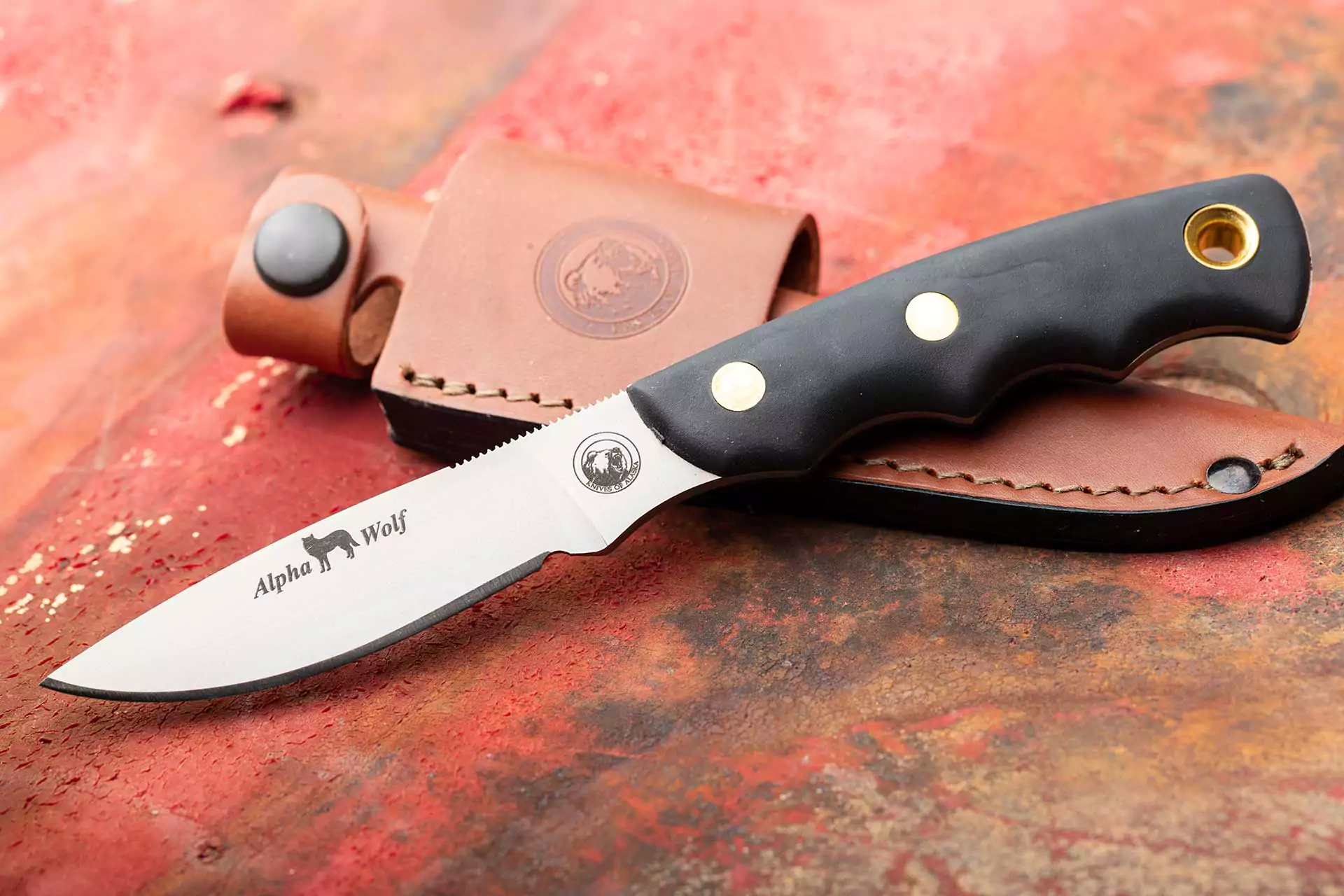 Knives of Alaska Alpha Wolf knife with black SureGrip handle and leather sheath