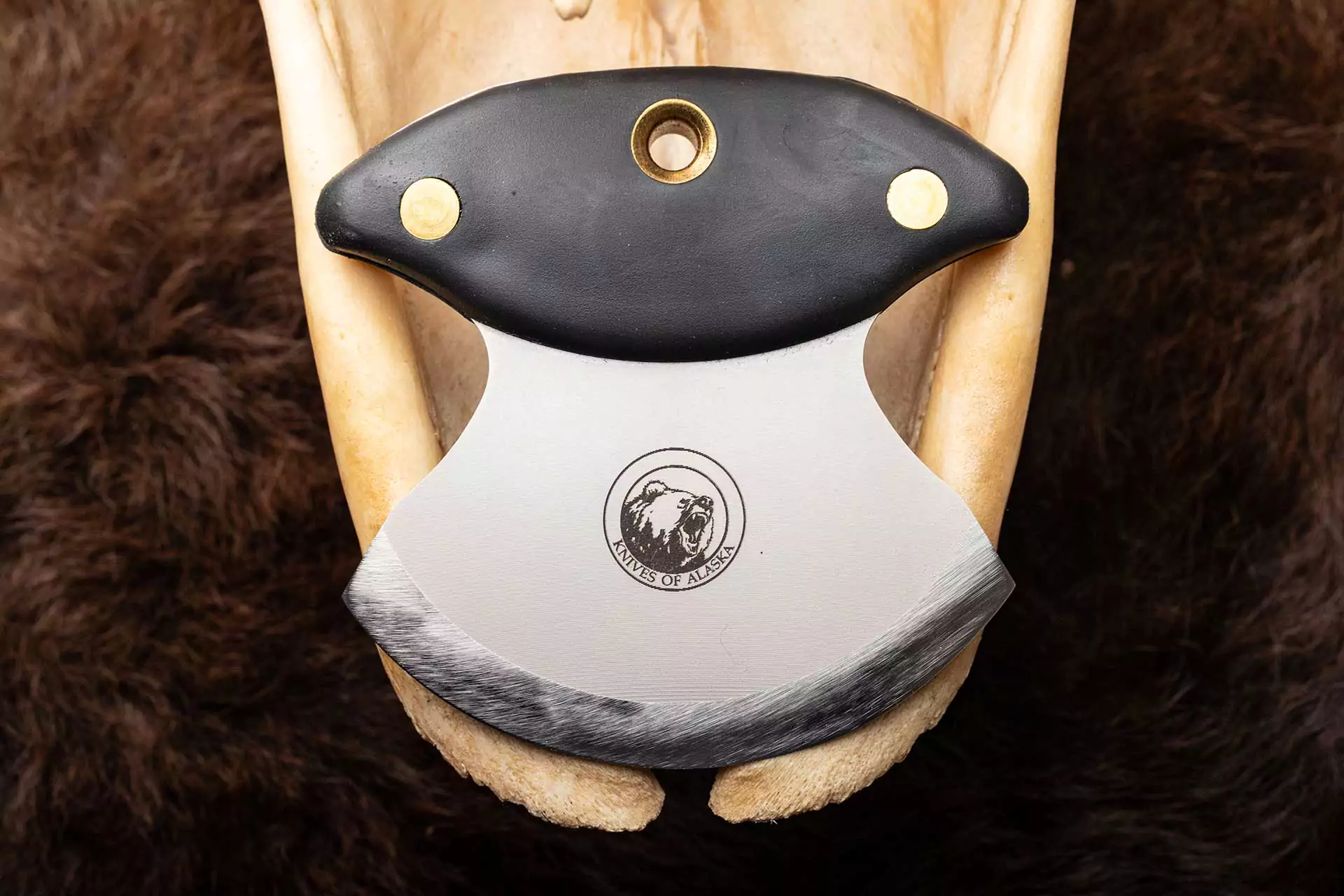 Close-up of Knives of Alaska Magnum Ulu with black handle and D2 steel blade