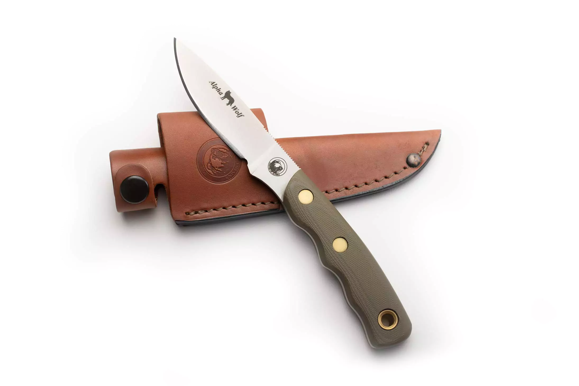 Alpha Wolf knife with OD green G10 handle resting on its leather sheath