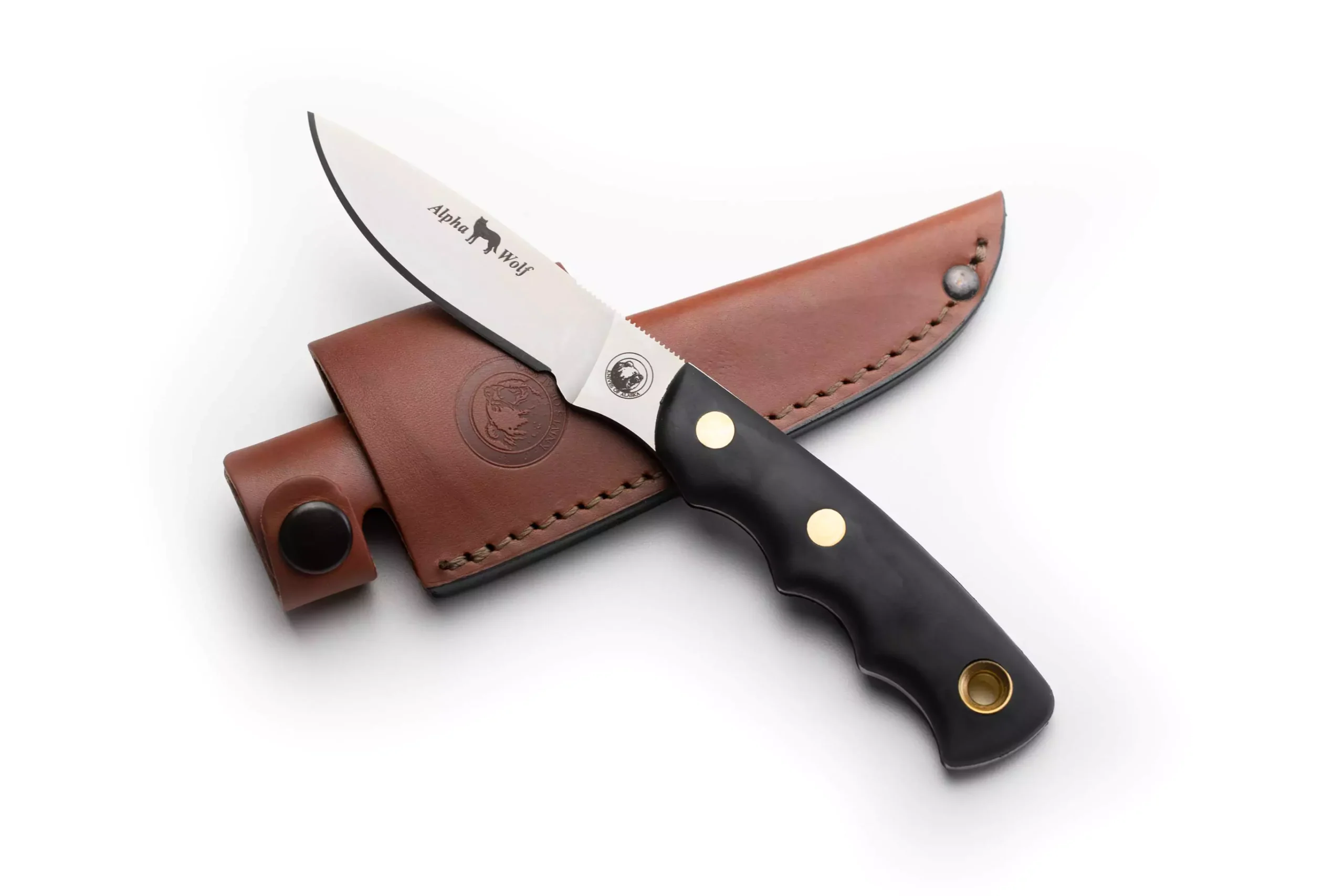 Alpha Wolf knife with Suregrip handle resting on leather sheath