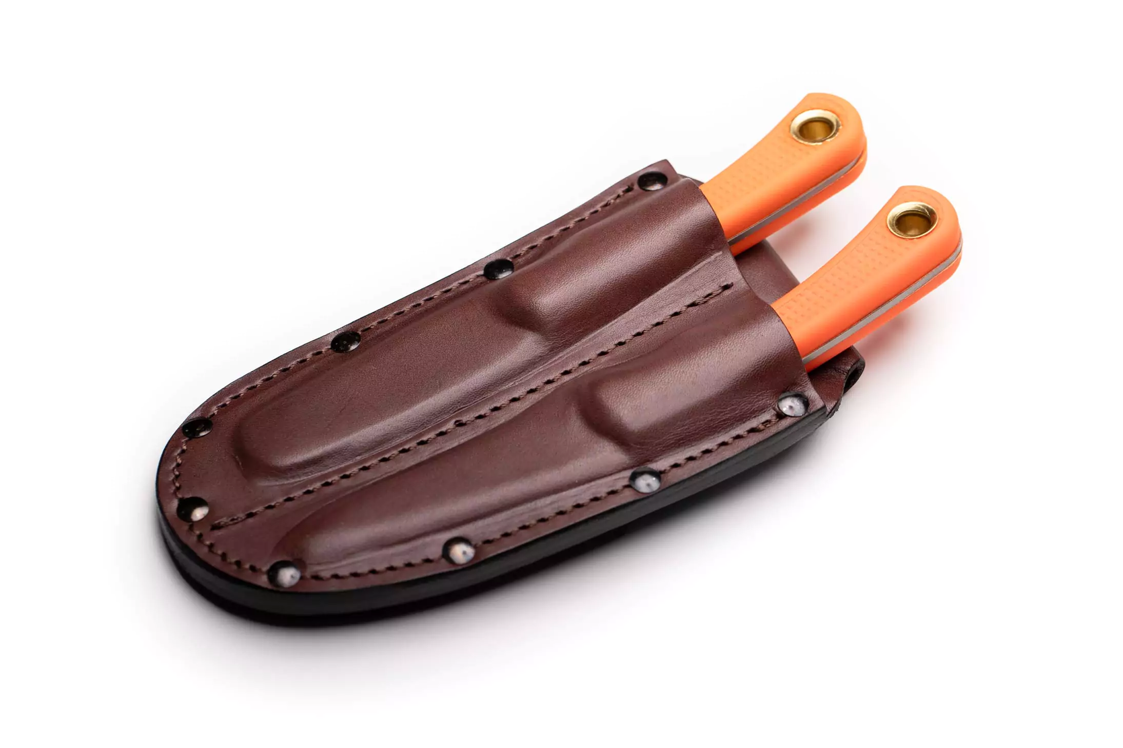 Knives of Alaska dual brown leather sheath holding orange-handled knives