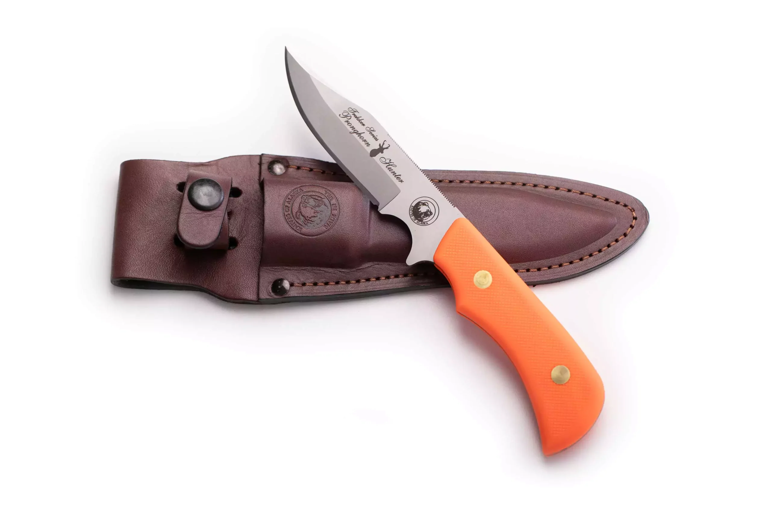 Trekker Pronghorn Hunter knife with orange Suregrip handle and brown leather sheath.