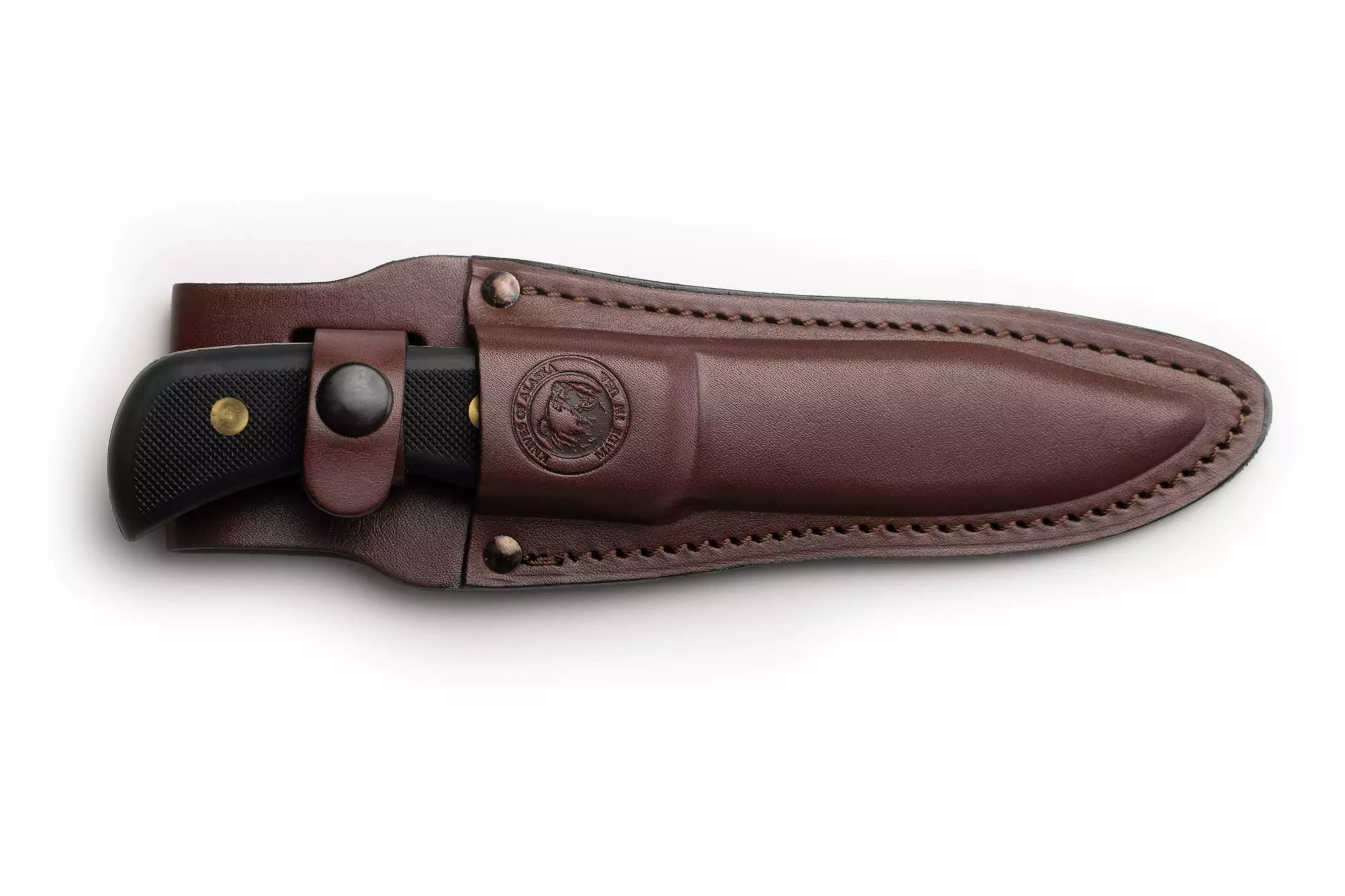 Trekker Pronghorn Hunter knife with Suregrip black handle secured inside a brown leather sheath.