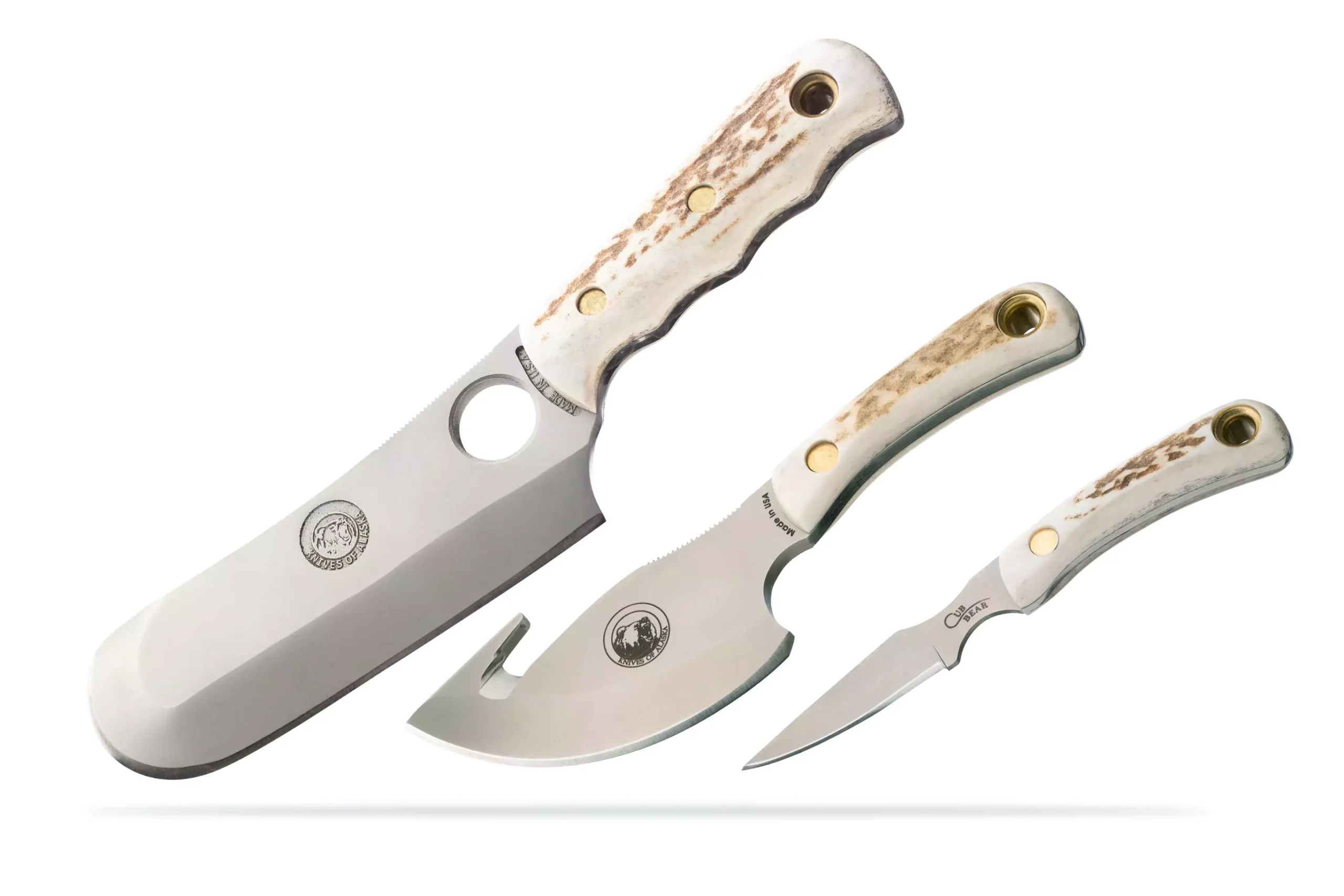 Knives of Alaska Stag Triple Combo set showing Brown Bear Skinner/Cleaver, Light Hunter, and Cub Bear Caping Knife with stag handles.