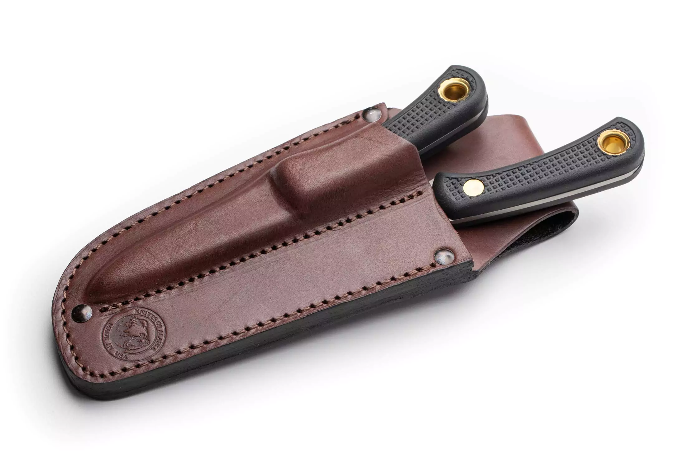 Black-handled Caribou and Cub Bear combo knives sheathed in brown leather case from Knives of Alaska.