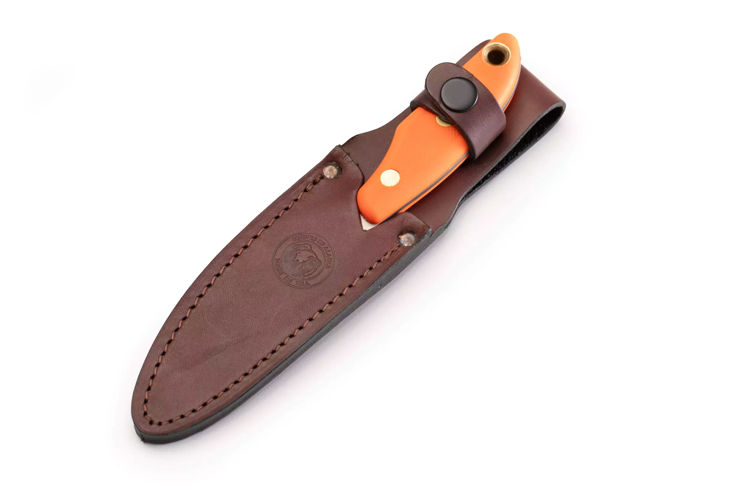 Knives of Alaska Badger knife secured in a brown leather sheath with SureGrip handle.