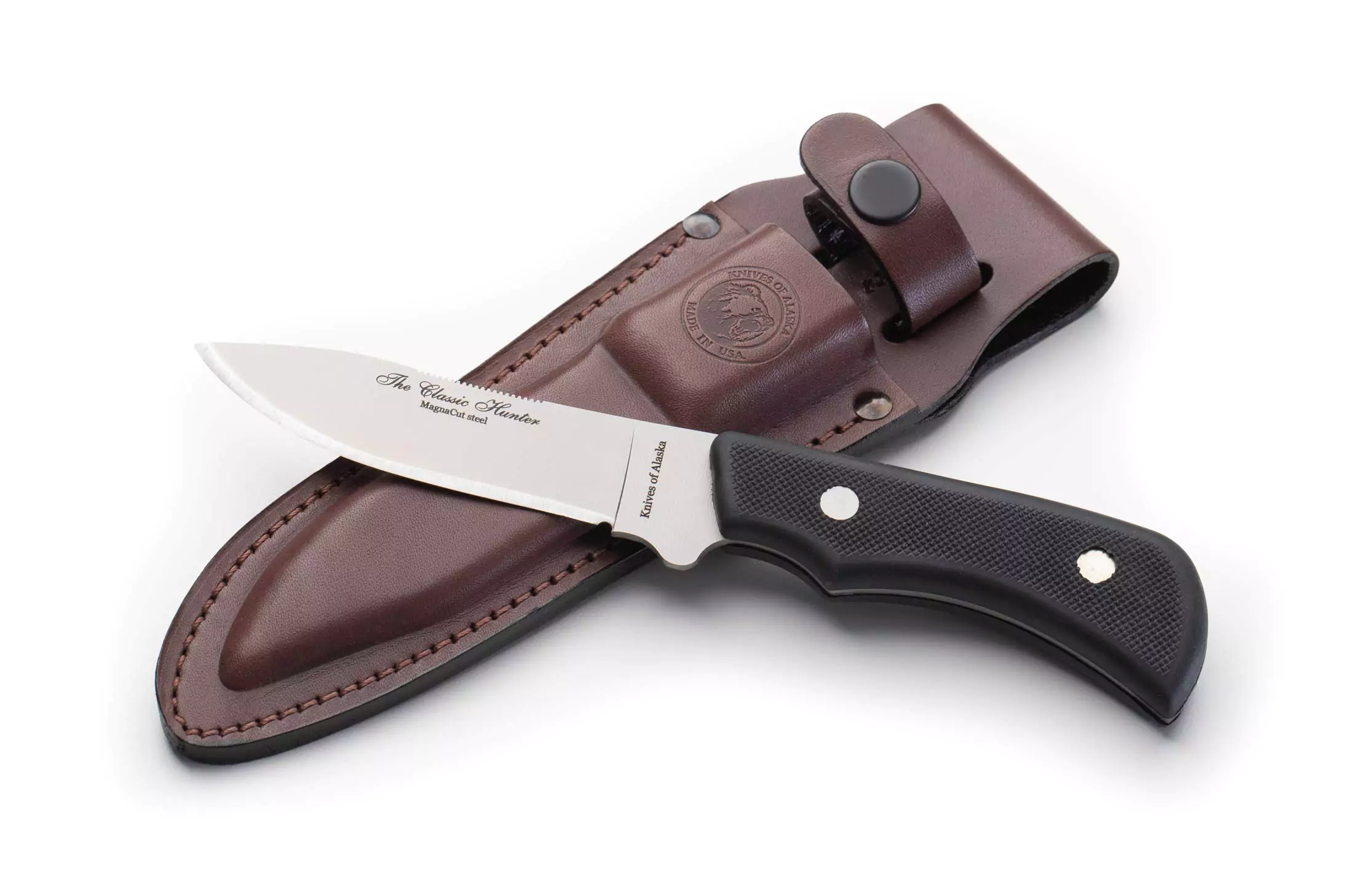 Knives of Alaska Classic Hunter knife with Magnacut steel blade and Suregrip handle resting on leather sheath