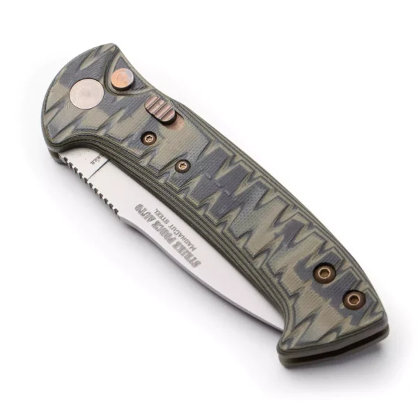 Knives of Alaska Strike Force Auto knife shown closed, featuring a patterned OD green G10 grip, bronze hardware, and non-serrated Magnacut steel blade partially visible.