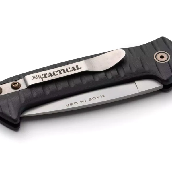 Knives of Alaska Recon Patrol Auto knife in closed position, featuring a black G10 Suregrip handle and partially visible Magnacut steel blade.